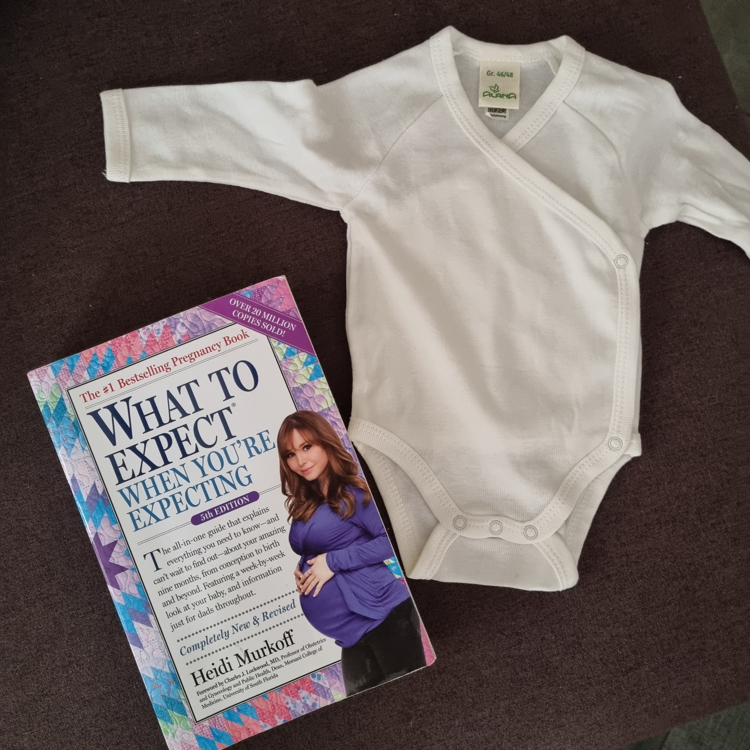 The book and our baby's first onesie 💗.